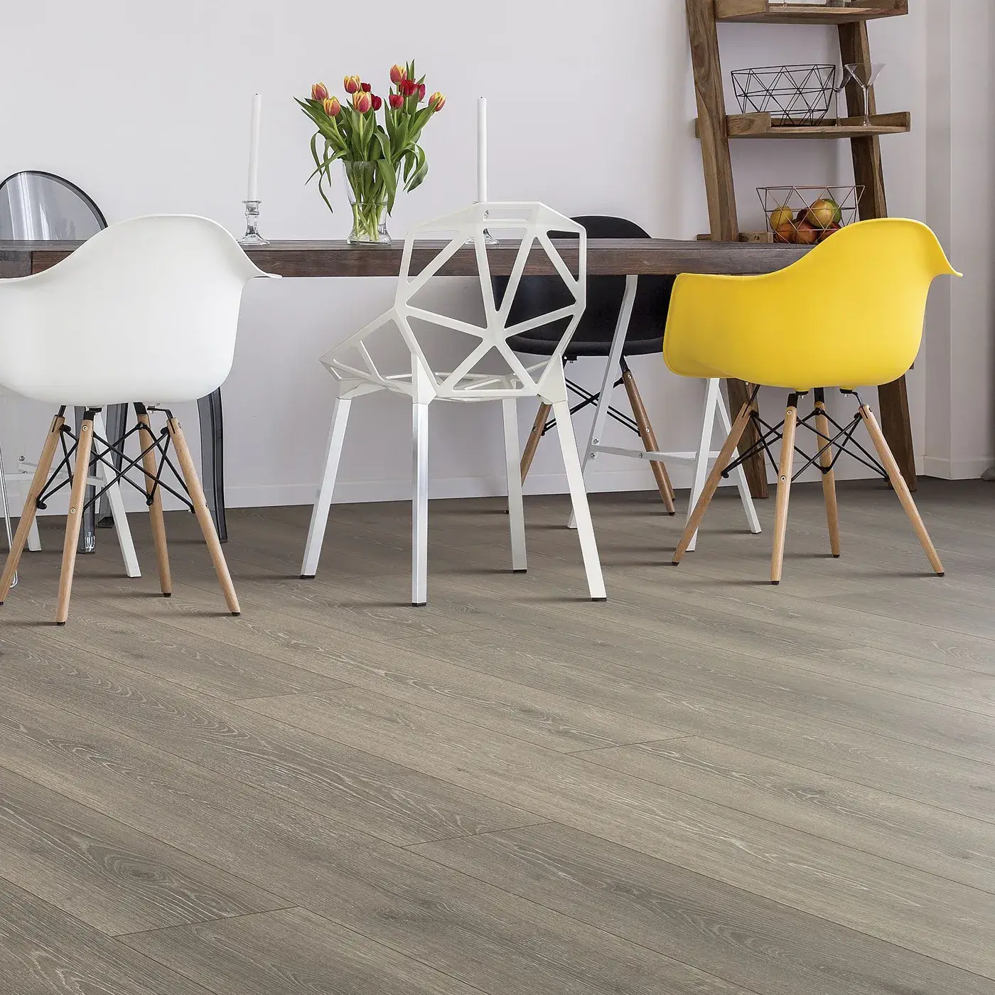 33634_06W_room Laminate in a gray-brown wood tone in a modern dining room | Myers Flooring of Nashville